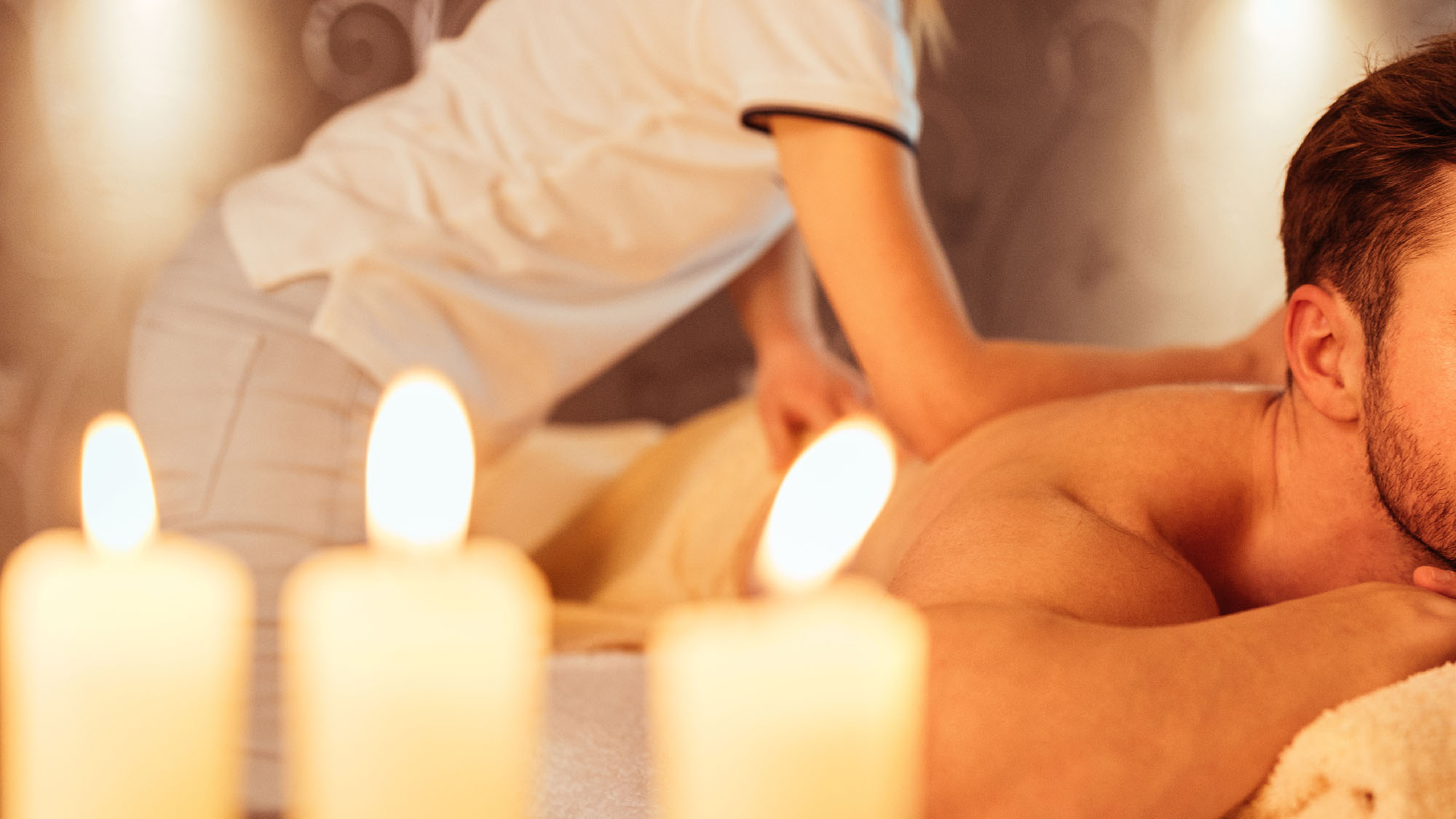 Young man enjoying a massage at a spa