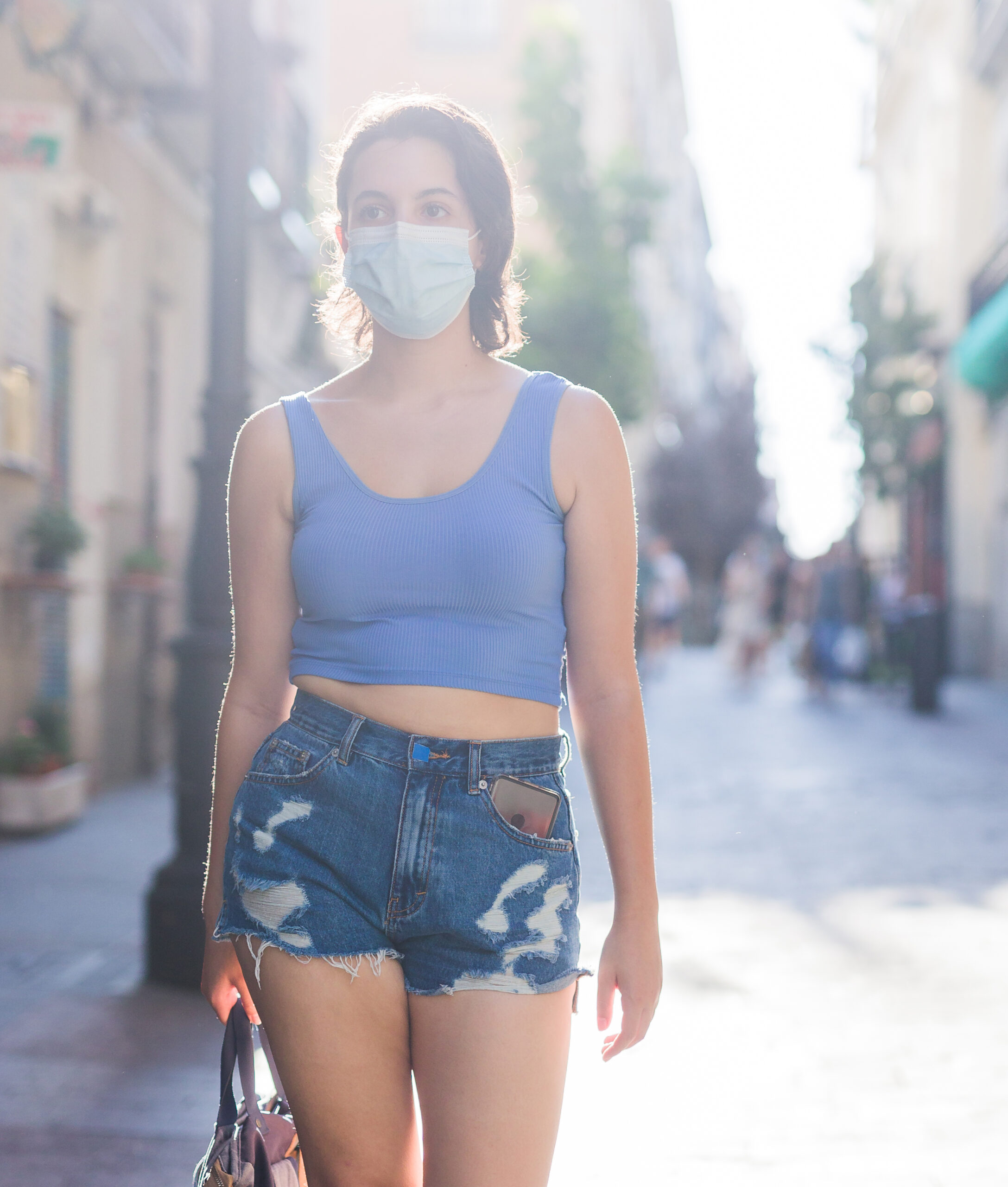 surgical mask protection pedestrian portrait. female shopper